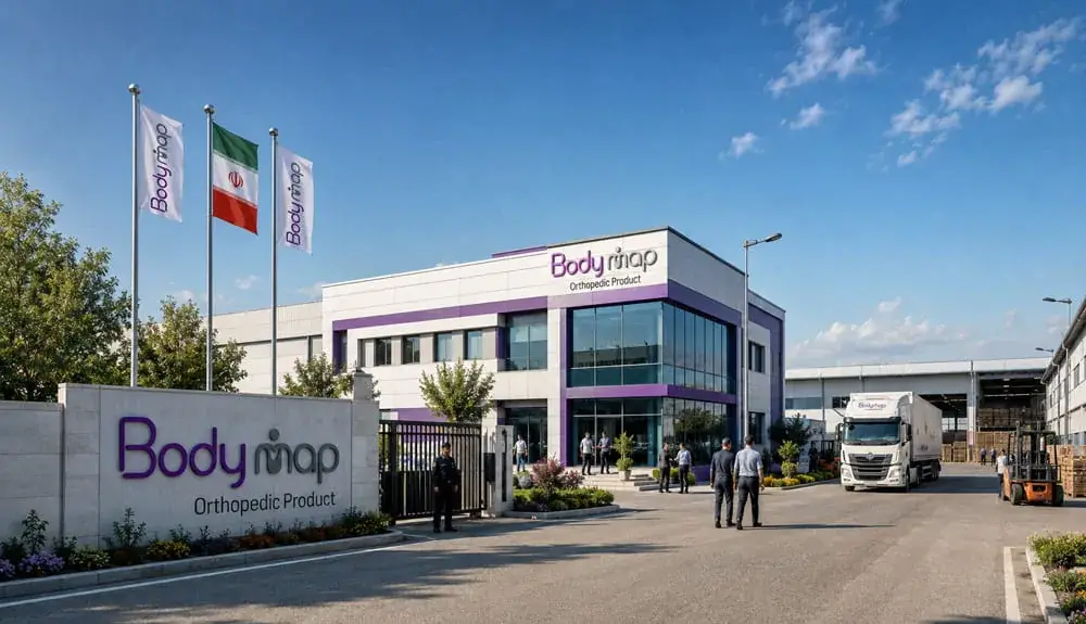 The Bodymap building seen from the entrance road, with flags at the gate and a delivery lorry at the loading bay.