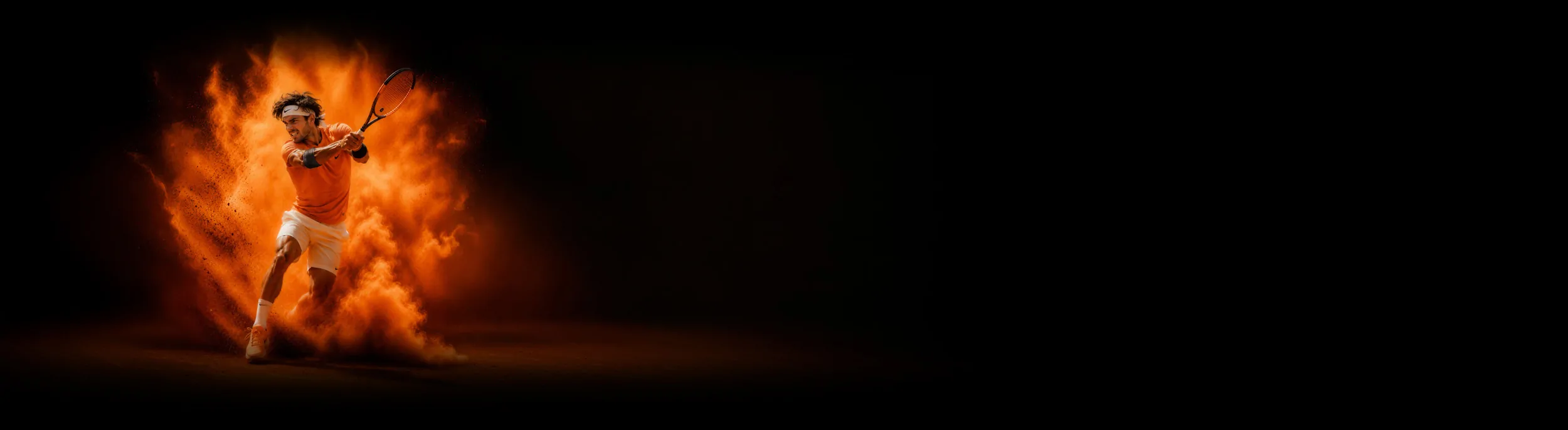 A tennis player striking a backhand inside a burst of orange clay dust, wearing a strap on the forearm.