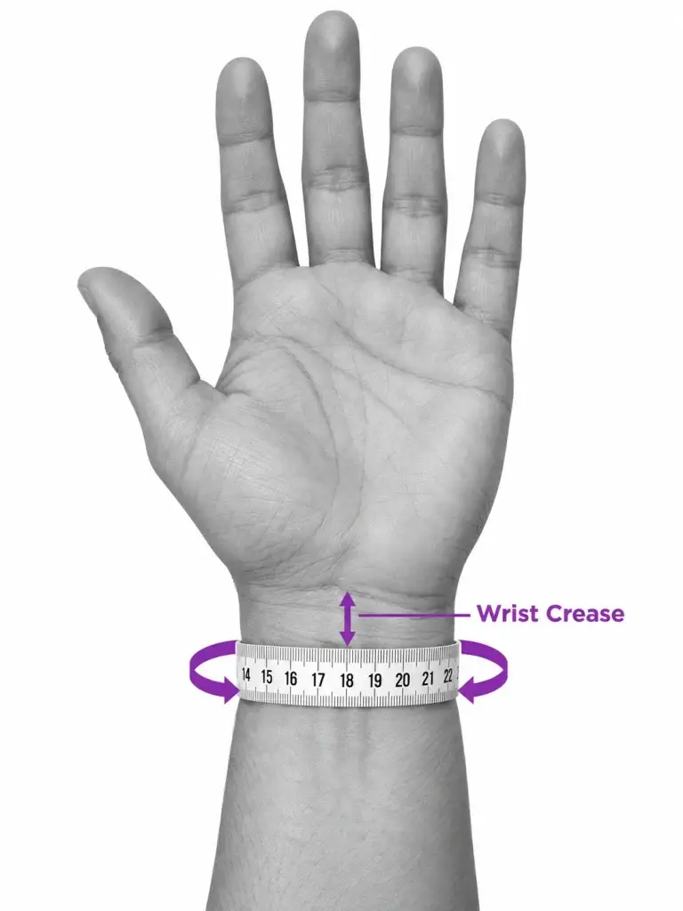 A measuring tape wrapped around the wrist at the wrist crease